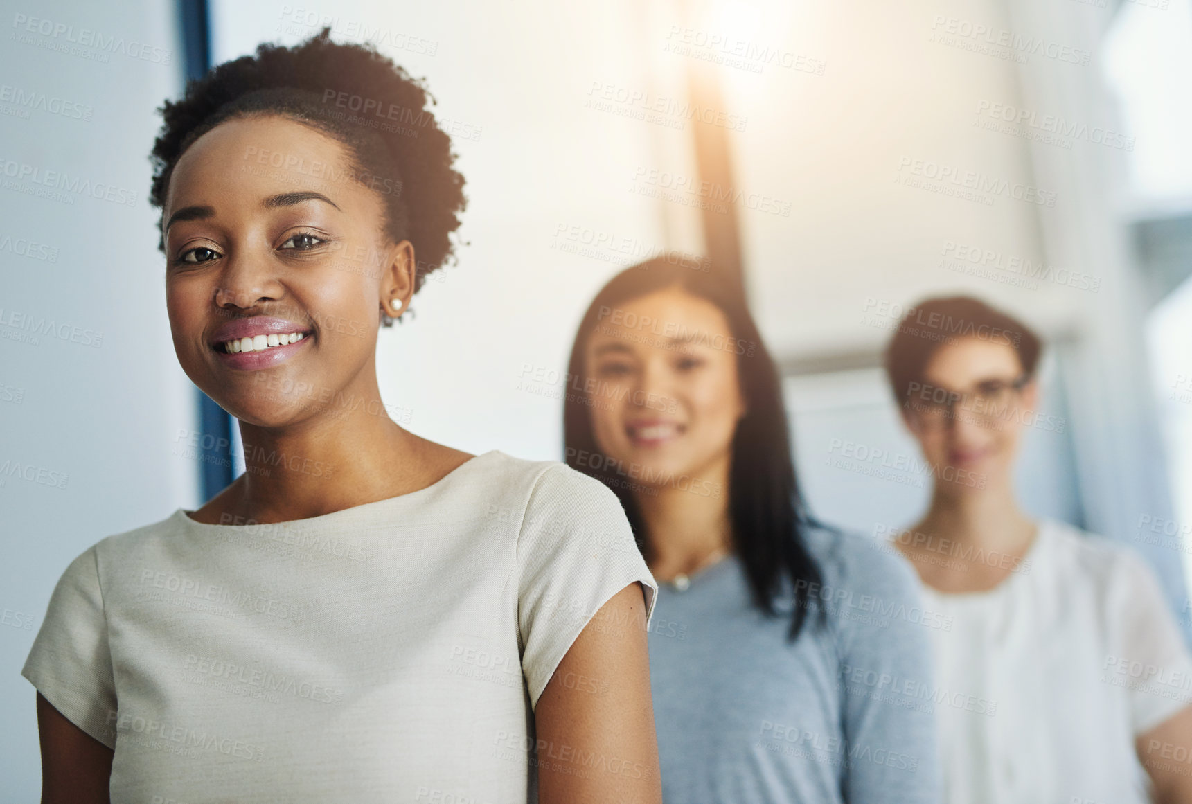 Buy stock photo Cropped shot of a group of businesspeople standing in the office