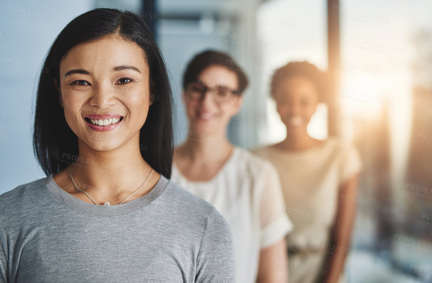 Buy stock photo Cropped shot of a group of businesspeople standing in the office