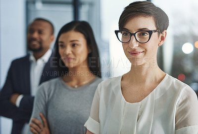 Buy stock photo Cropped shot of a group of businesspeople standing in the office