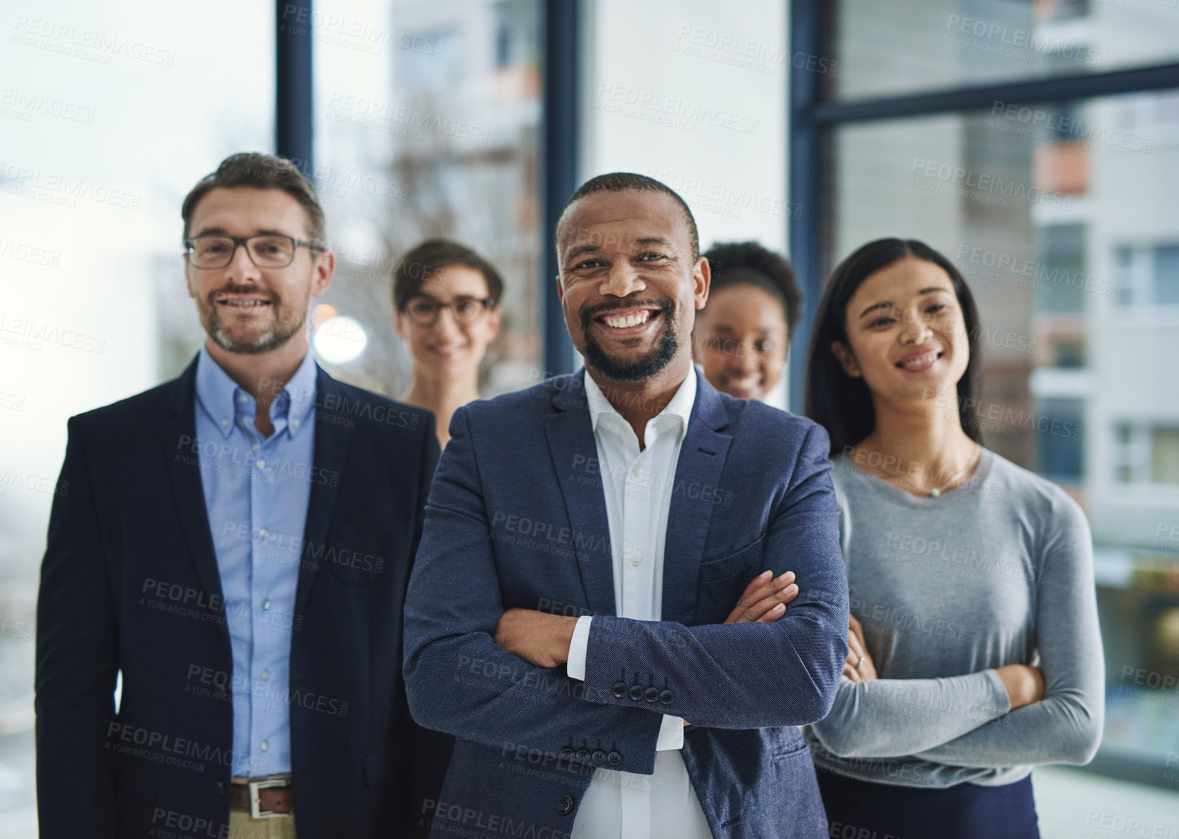Buy stock photo Portrait of a diverse team of professionals standing in the office