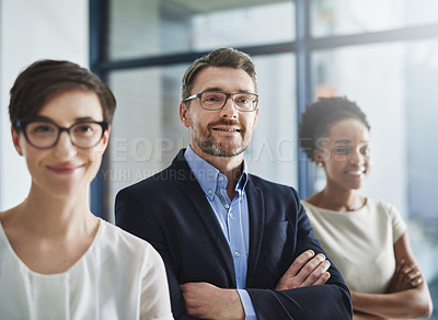 Buy stock photo Proud and happy leadership of a business on a mission to achieve the company vision and growth. Portrait of a team of colleagues with a positive mindset smiling and standing in unity or support