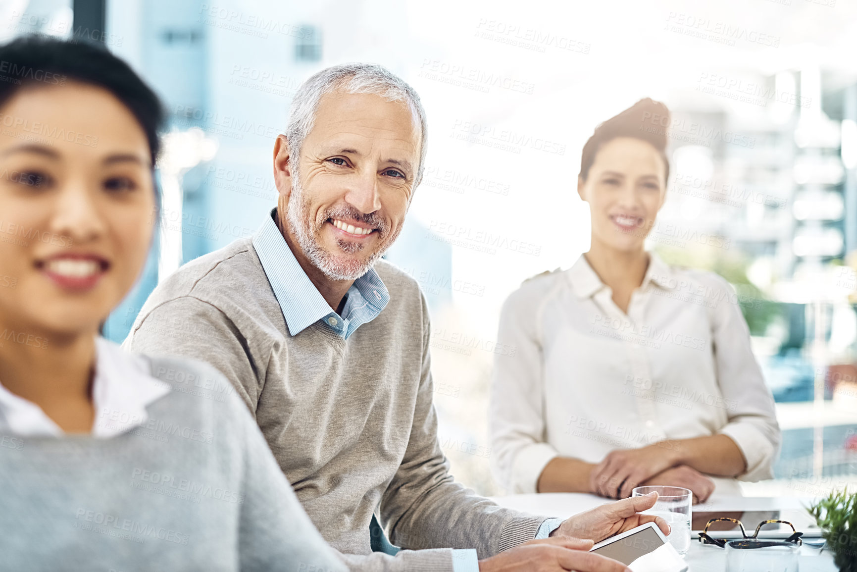 Buy stock photo Creative, meeting and portrait of people in project management with proposal, report or planning. Teamwork, collaboration and mature businessman with review, advice in workshop or feedback in office
