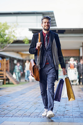 Buy stock photo Shot of a well dressed young man on a shopping spree