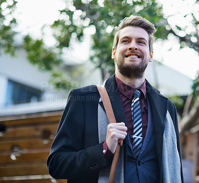 Buy stock photo Shot of a happy young businessman out in the city