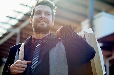 Buy stock photo Shot of a well dressed young man on a shopping spree