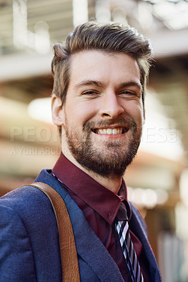 Buy stock photo Portrait of a happy young businessman out in the city