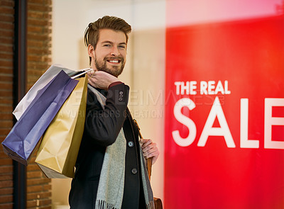 Buy stock photo Portrait of a happy young man on a shopping spree