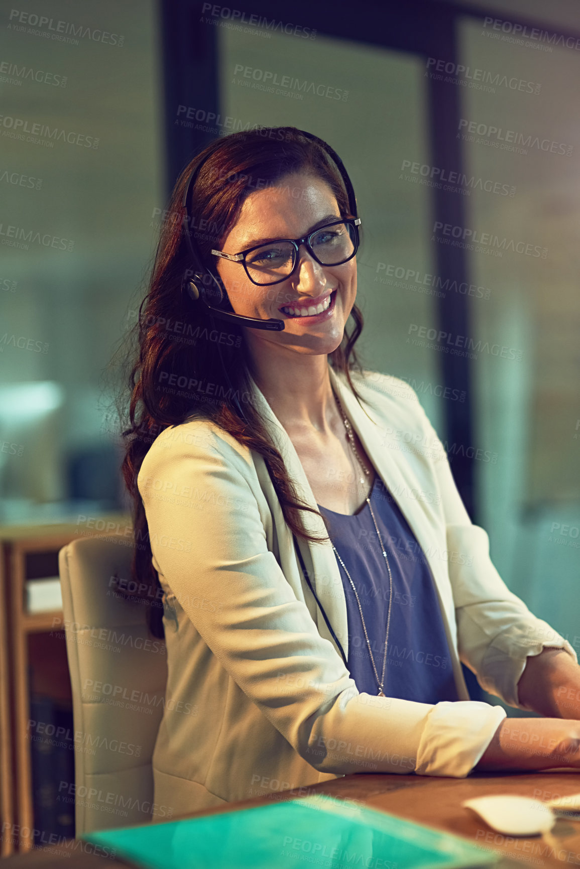 Buy stock photo Portrait of a young support agent working late in an office