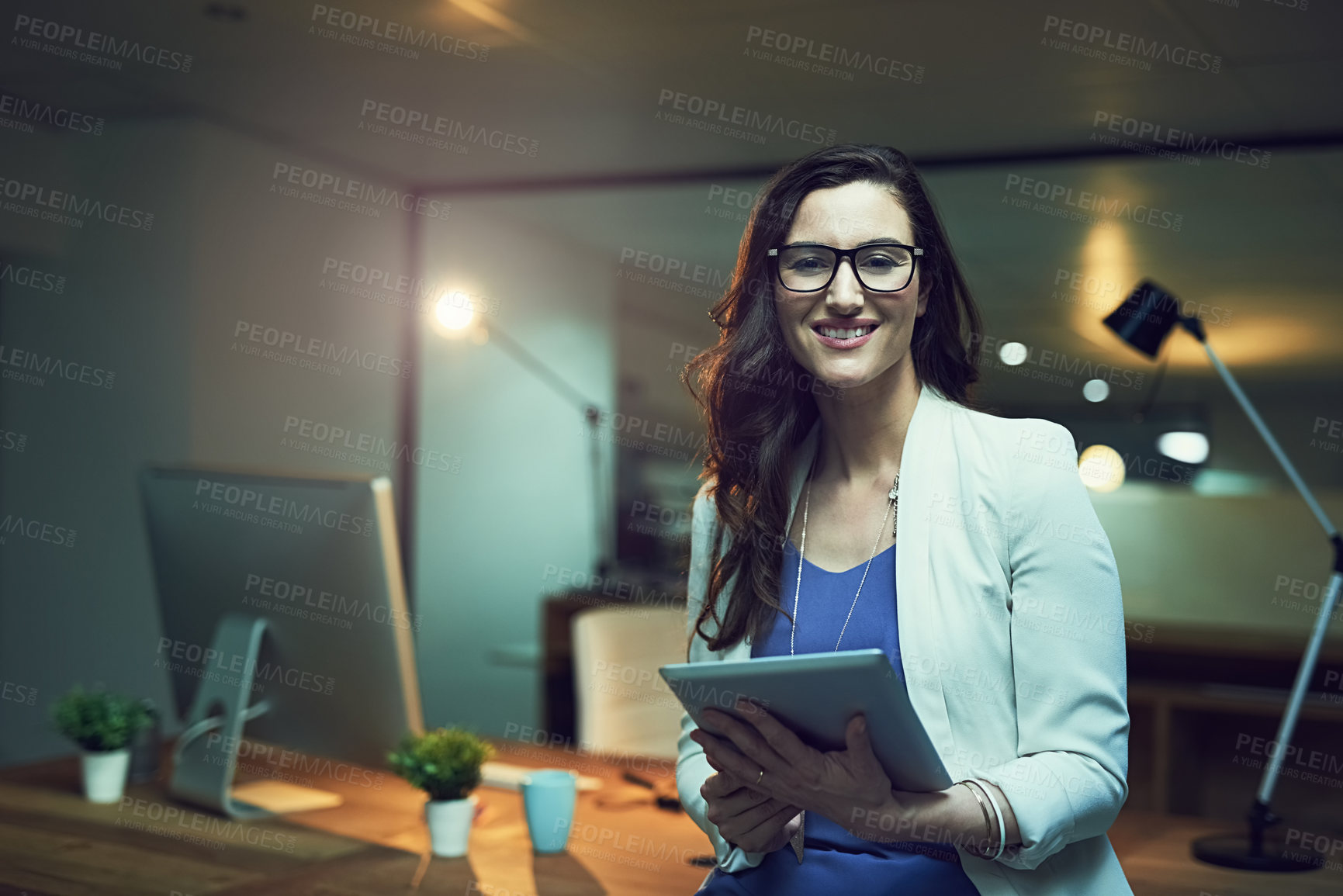 Buy stock photo Portrait, night and business woman with tablet in office for planning, schedule or researching project. Smile, digital developer and happy employee with tech for networking, website review or online