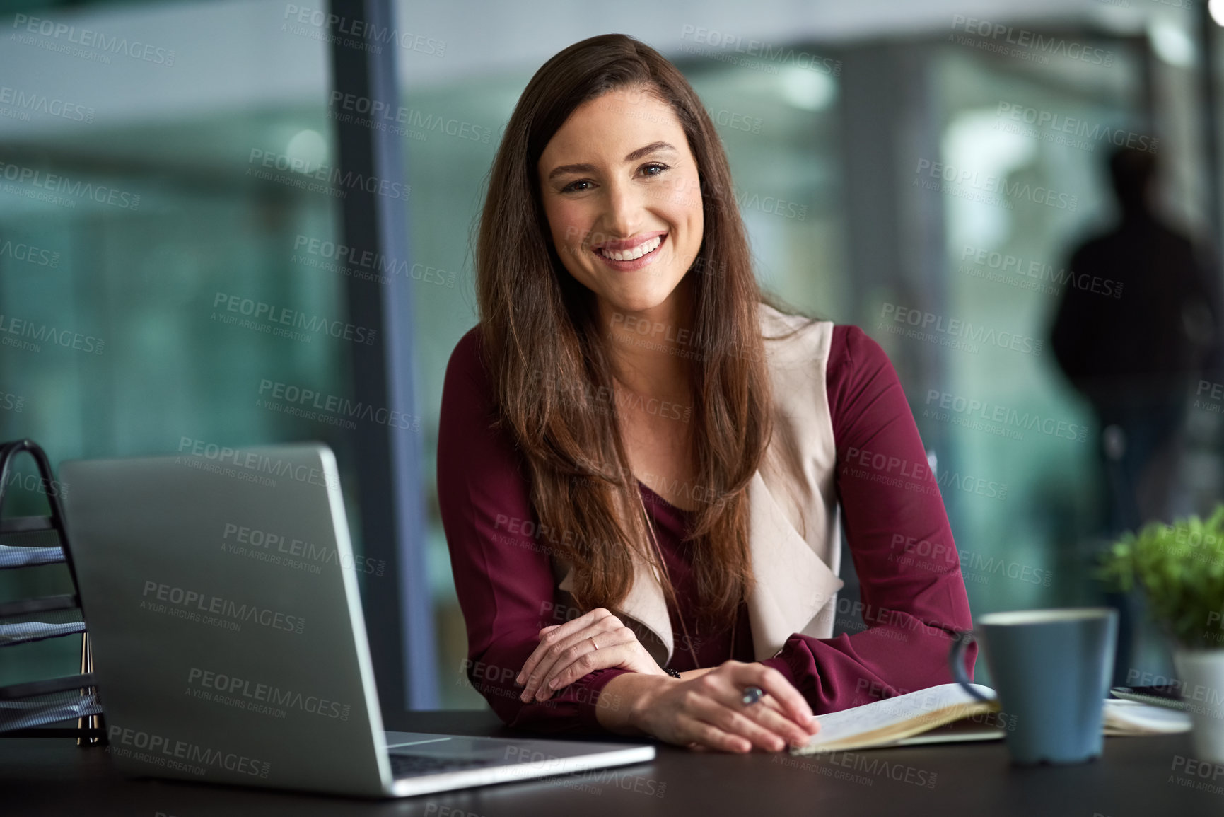 Buy stock photo Shot of a businesswoman sitting at her desk with her laptop