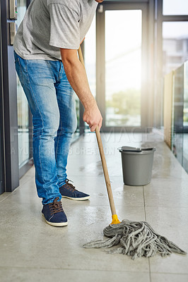 Buy stock photo Janitor, mop and clean floor in office for routine maintenance, cleanliness and sanitation in workspace. Washing tiles, person and ground staff in company for spill, disinfection and hygiene