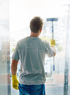Buy stock photo Janitor, cleaning and window scraper in hand for washing glass, housework and disinfect with shine. Male person, hygiene or sanitary services for health care, maintenance or hospitality professional