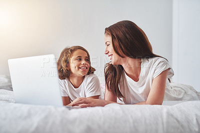 Buy stock photo Mother, child and laptop on bed in room for fun, streaming and online game at home. Woman, daughter and happy in living space for comedy, joke and funny video while watching together for bonding
