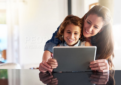 Buy stock photo Mother, child and tablet in apartment for elearning, education and connection in family home. Mom, young girl and technology in house for social network, online streaming and teaching on weekend 