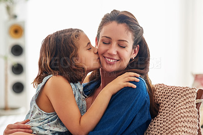 Buy stock photo Cropped shot of a young girl kissing her mother at home