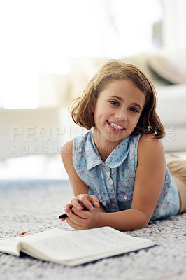 Buy stock photo Girl, floor and read for education with portrait, smile and learn in home living room. Lounge, smile and story book for literature and learning for hobby, lounge and ground for happy female child