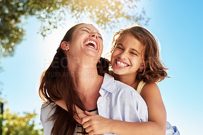 Buy stock photo Cropped shot of a mother and daughter enjoying the day outside