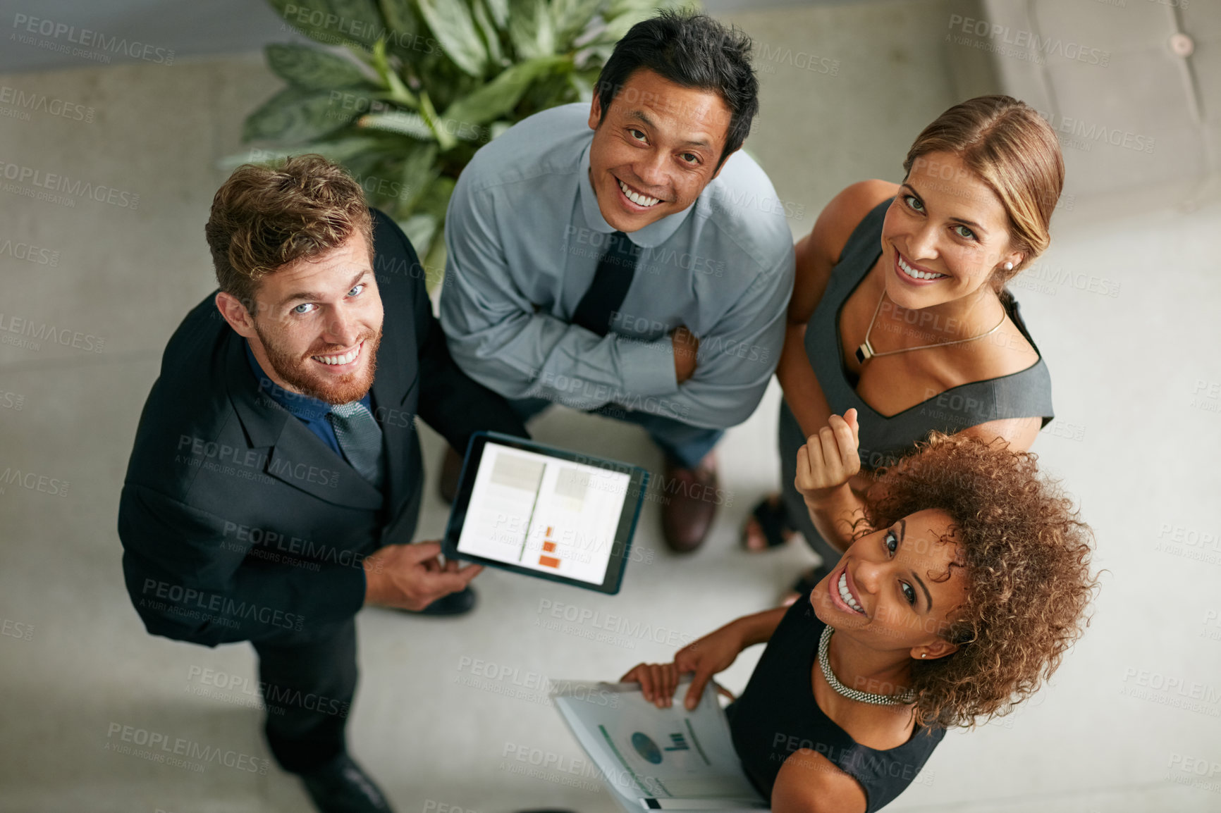 Buy stock photo Business people, circle and above with tablet in portrait at office with diversity, teamwork and happy at job. Men, women and group on app for graphs, stats or research for economy at finance agency