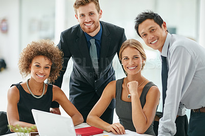 Buy stock photo Portrait of a group of businesspeople working on a  laptop together in a modern office