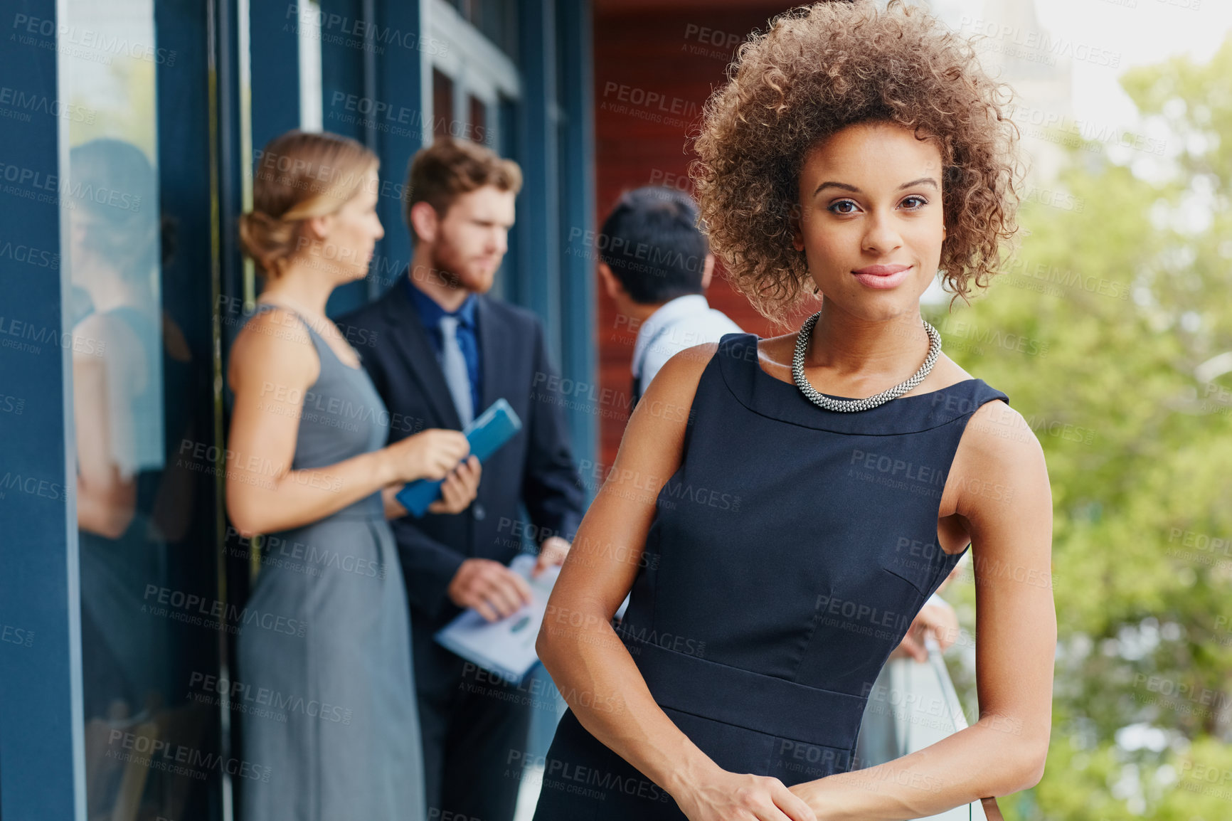Buy stock photo Professional, portrait and woman on balcony with colleagues for pride, corporate lawyer or attorney outdoor. Person, smile and confidence for expert in acquisition or legal representative at law firm
