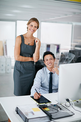 Buy stock photo Shot of two colleagues working together on a computer