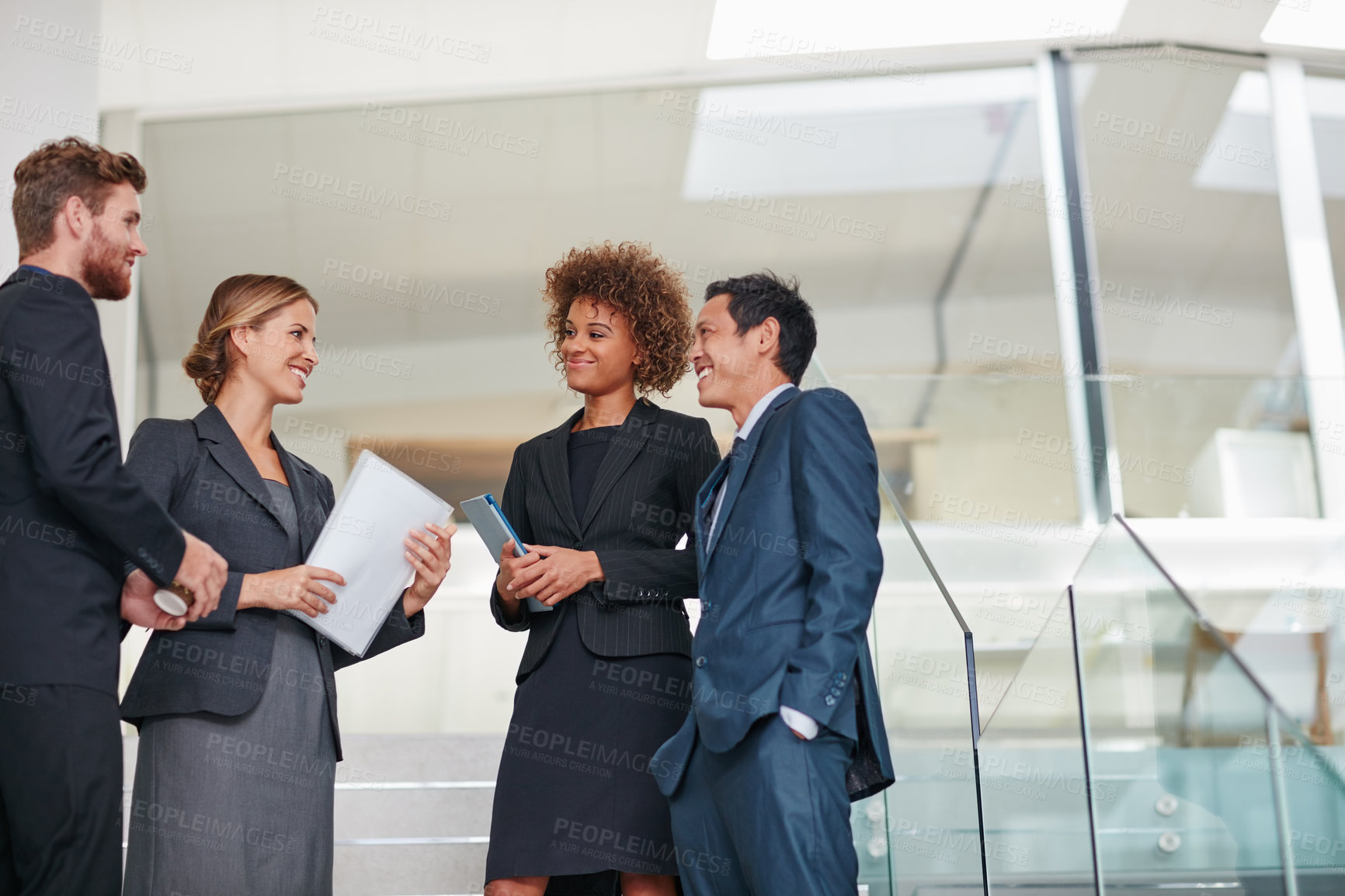 Buy stock photo Cropped shot of businesspeople having a discussion in a modern office