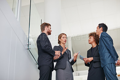Buy stock photo Cropped shot of businesspeople having a discussion in a modern office
