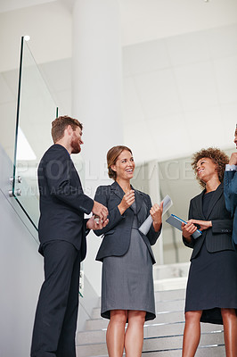 Buy stock photo Cropped shot of businesspeople having a discussion in a modern office