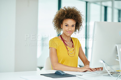 Buy stock photo Shot of a businesswoman working on her computer in the office