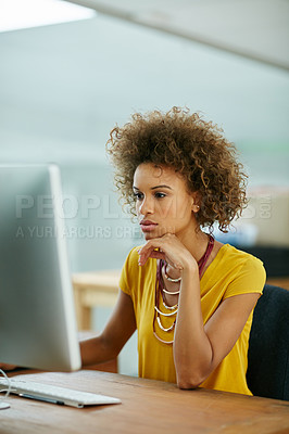 Buy stock photo Shot of a businesswoman working on her computer in the office