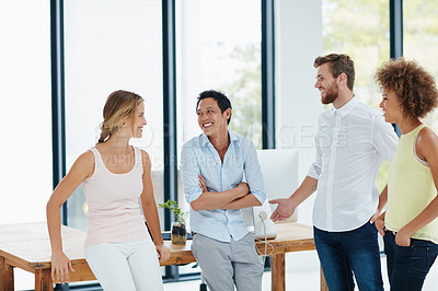 Buy stock photo Shot of a group of colleagues having a conversation in the office