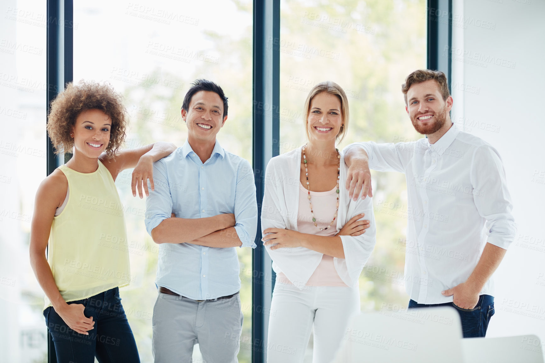 Buy stock photo Portrait of a group of businesspeople standing together in their office