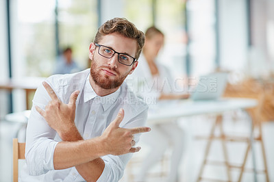 Buy stock photo Portrait of a businessman making a hand gesture in the office