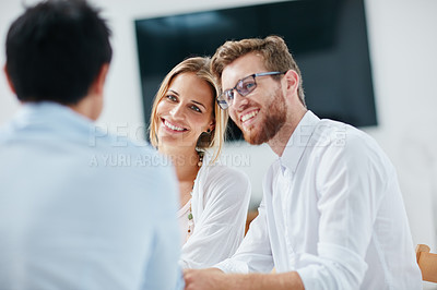 Buy stock photo Shot of a group of businesspeople discussing ideas together in the office