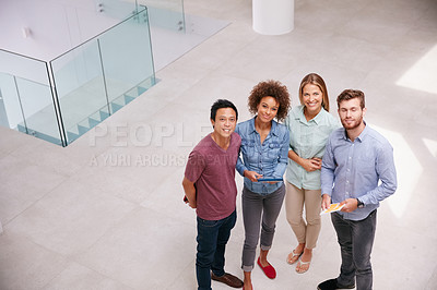Buy stock photo High angle portrait of a group of businesspeople standing together in an office