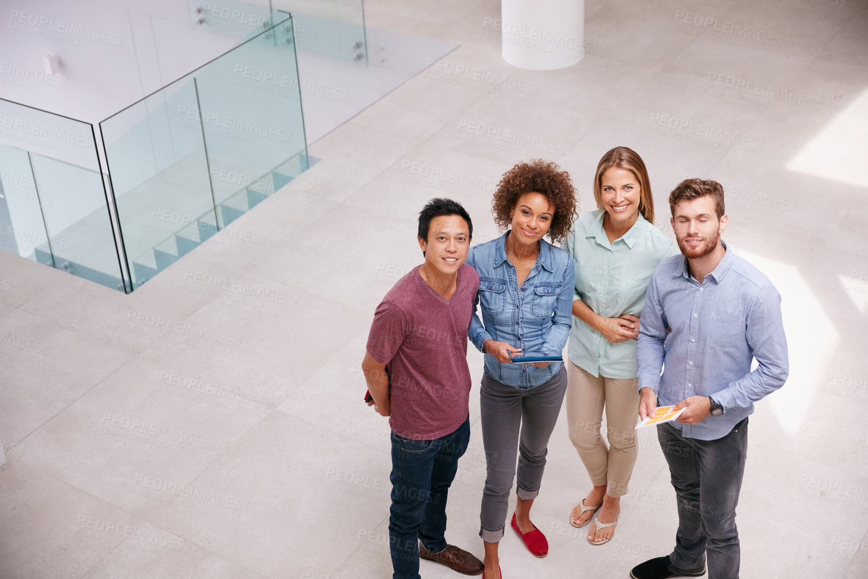 Buy stock photo High angle portrait of a group of businesspeople standing together in an office