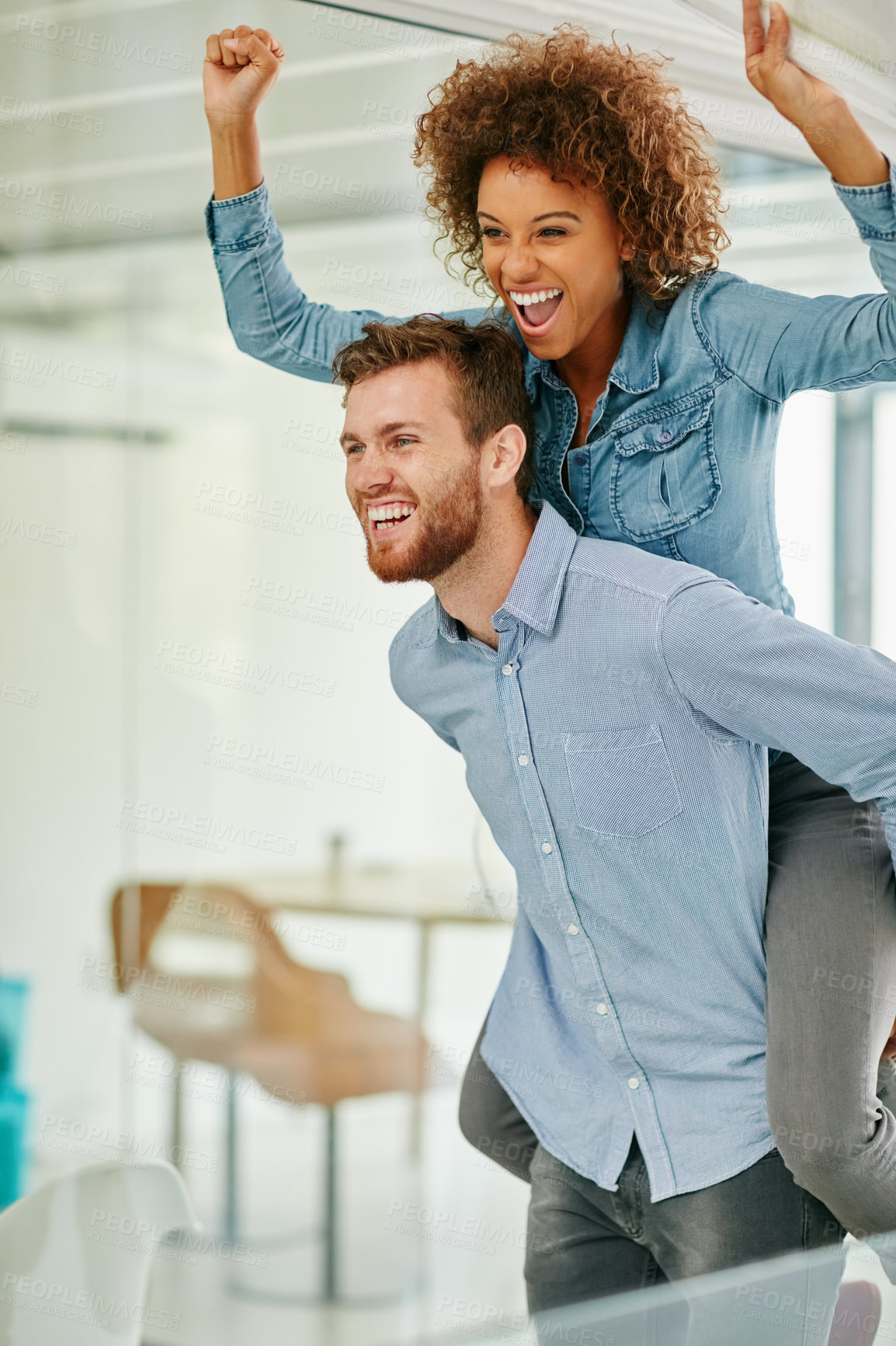 Buy stock photo Cropped shot of a young businessman piggybacking a colleague in an office