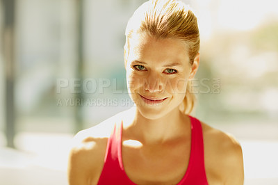 Buy stock photo Cropped portrait of an attractive young woman in workout attire