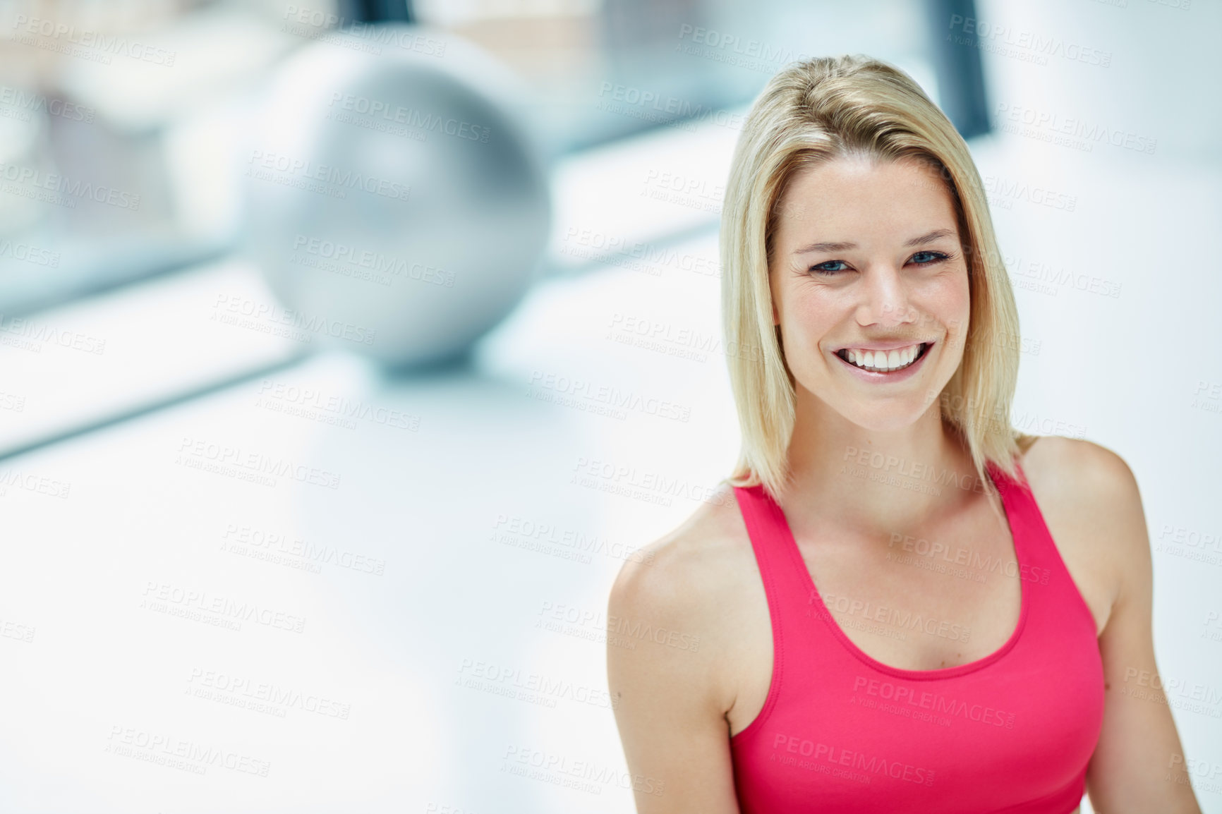 Buy stock photo Cropped portrait of an attractive young woman in workout attire