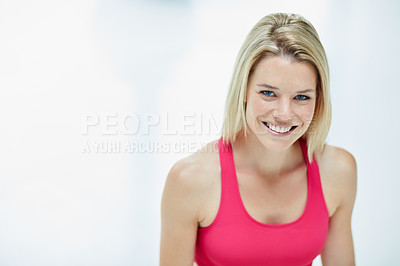 Buy stock photo Cropped portrait of an attractive young woman in workout attire