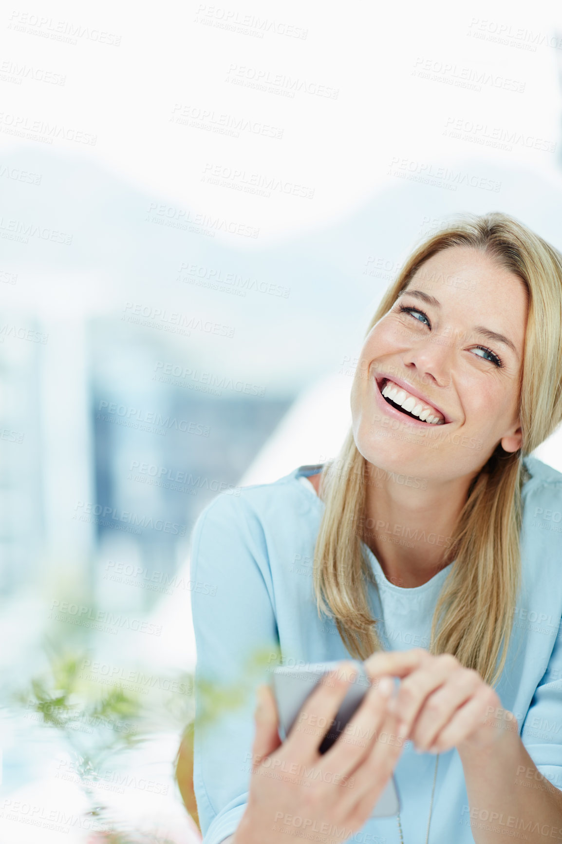 Buy stock photo Cropped shot of a young businesswoman texting on a cellphone in an office