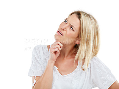 Buy stock photo Studio shot of a young woman looking confused against a white background