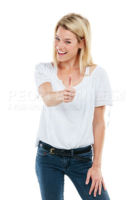 Buy stock photo Studio portrait of an attractive young woman giving thumbs up against a white background