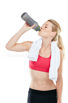 Buy stock photo Studio shot of an athletic young woman holding a water bottle