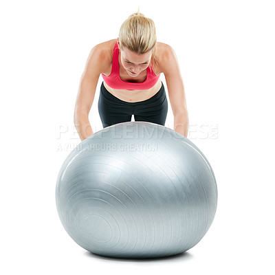 Buy stock photo Studio shot of a young woman working out with her exercise ball