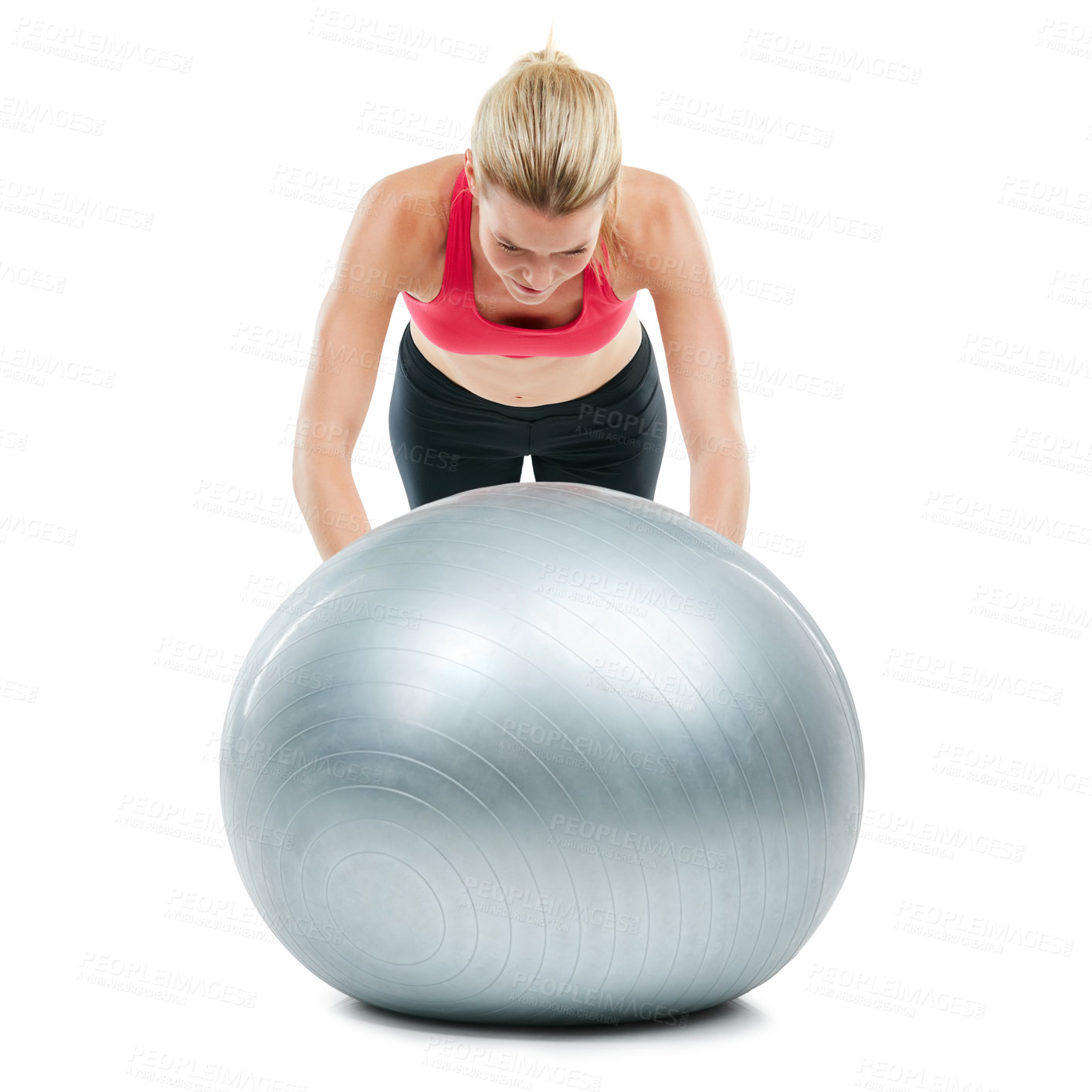 Buy stock photo Studio shot of a young woman working out with her exercise ball