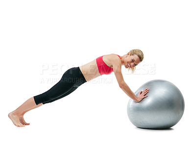 Buy stock photo Studio shot of a young woman working out with her exercise ball