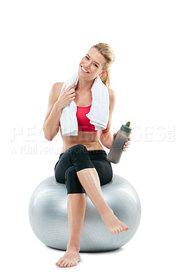 Buy stock photo Studio shot of a young woman working out with her exercise ball