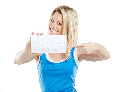 Buy stock photo Studio shot of an attractive young woman holding up a blank card