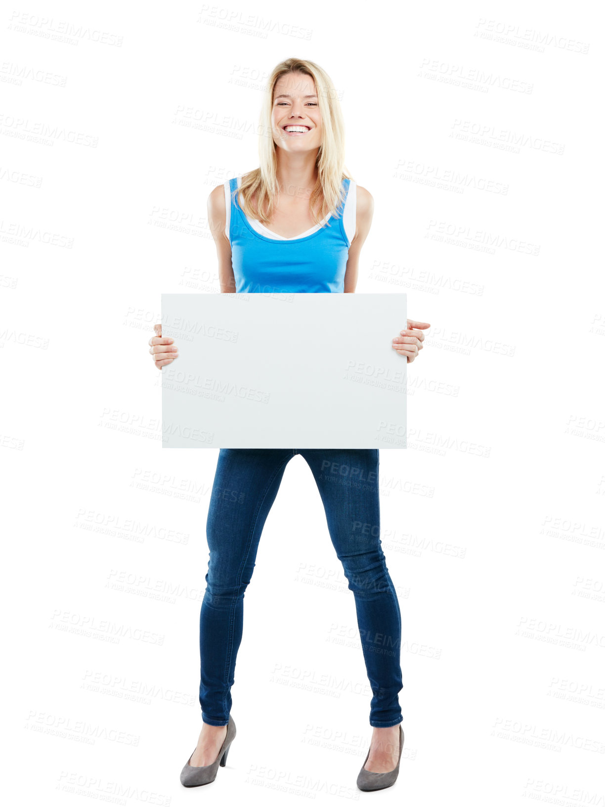 Buy stock photo Studio shot of an attractive young woman holding up a blank placard